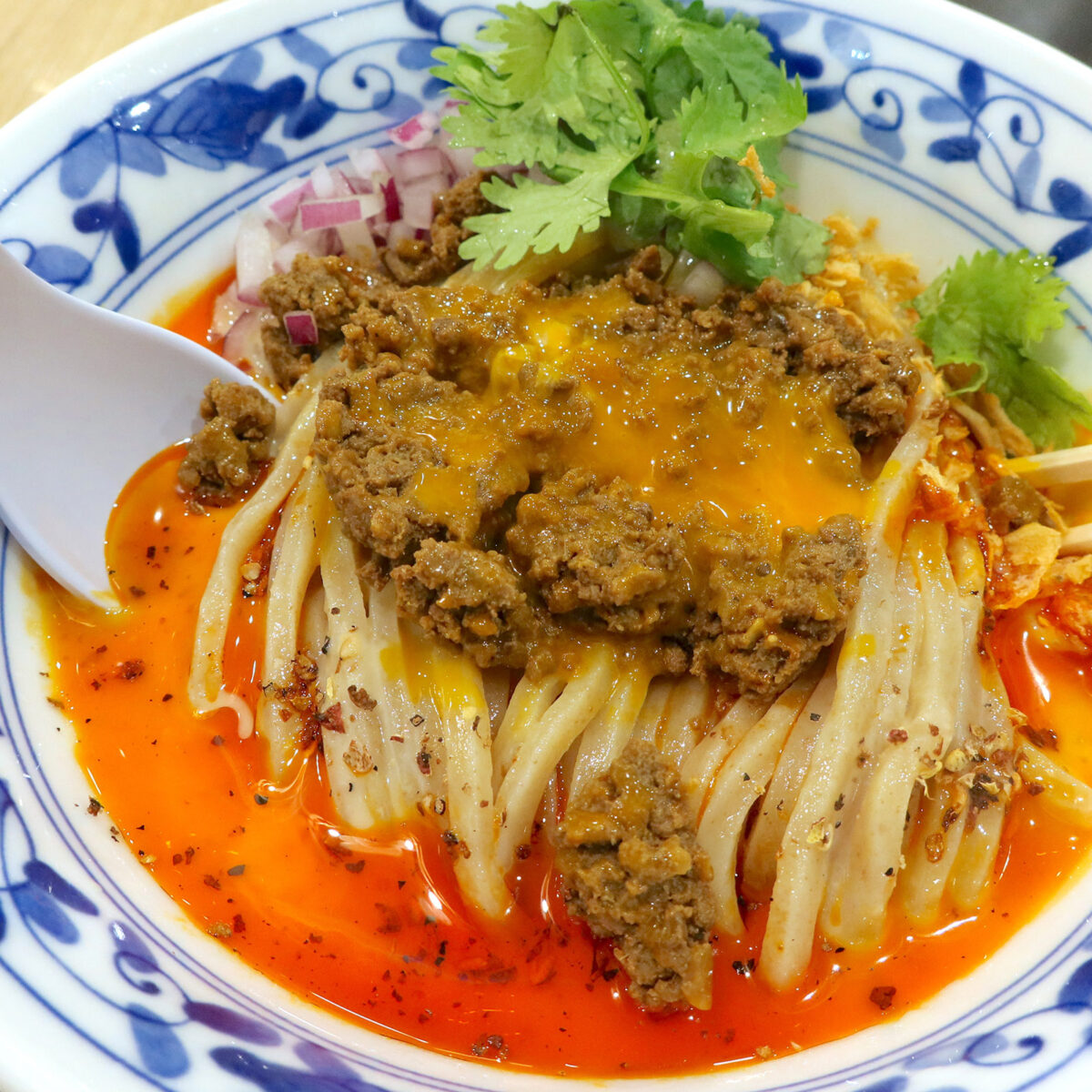 肉味噌を崩して